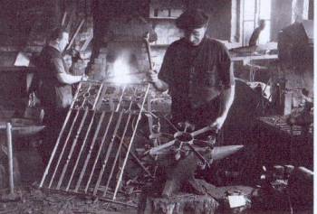 Jimmy High in his forge in Sheringham with his assistant Obadiah Sadler